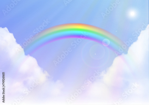 Rainbow on blue sky background 虹のかかった日が差し込む雨上がりの空