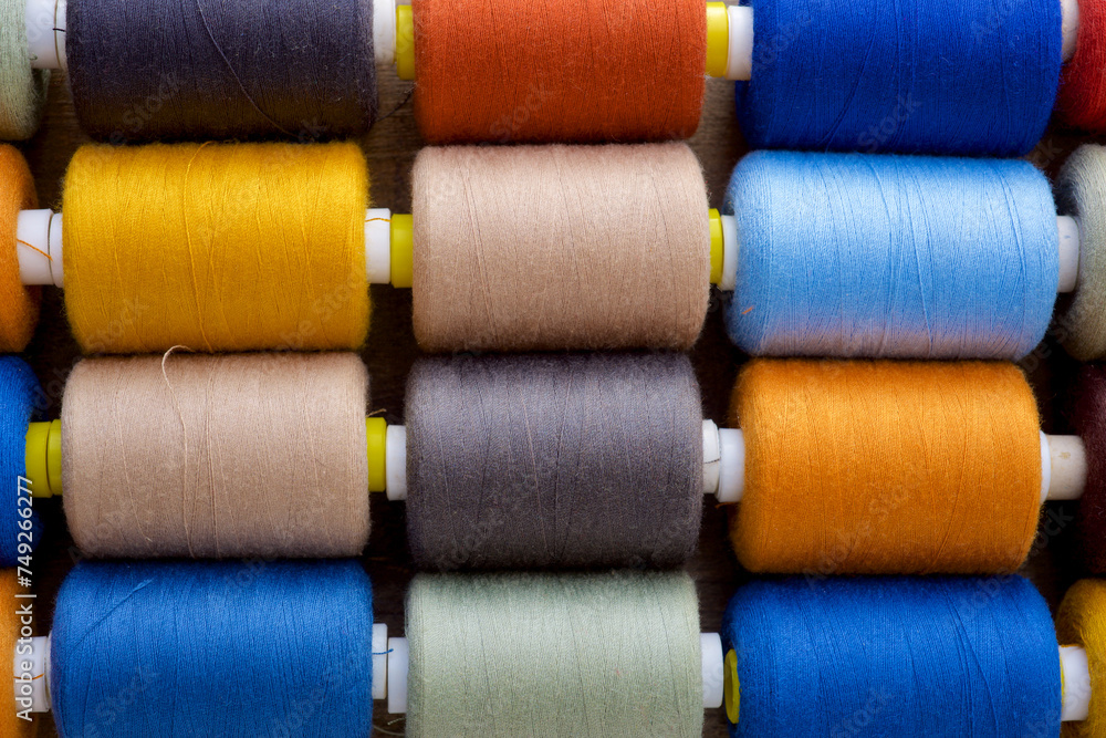 Close-up of multicolored sewing thread spools Close-up of multicolored sewing thread spools