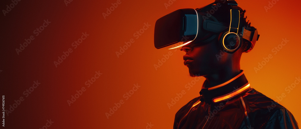 The silhouette of a person donning a virtual reality headset, bathed in dramatic red light