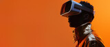 Profile of an individual wearing a VR headset, looking to the right side on an orange background