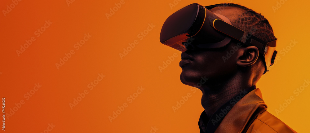 A person stands adorned in VR apparatus, the warm orange background suggesting a digital landscape and modern leisure time