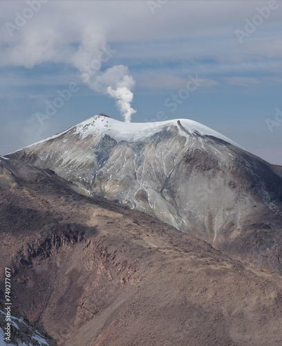 Climbing the Cerro Acotango, at border between Bolivia and Chile. 6052 meters high, with stunning views of the volcanoes Sajama and Parinacota photo