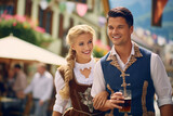 couple, man and woman in a dirndl outfit celebrate the Bavarian beer festival Oktoberfest together.