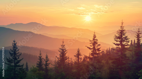 Sunrise over a mountainous landscape with trees.