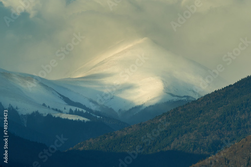 Steep mountain top covered by snow