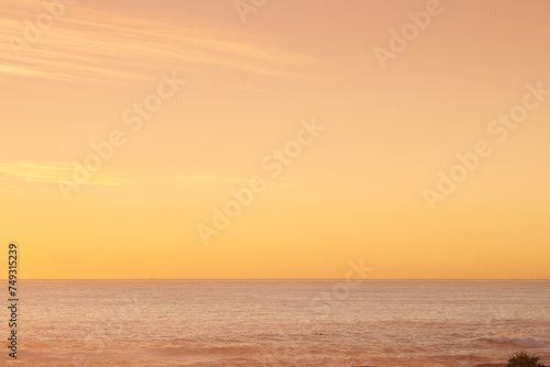 Beach, sunset and clouds, view and aerial for aesthetic and travel environment and sea. Orange sky, ocean and landscape in summer, trip and vacation for nature and calm sunlight in Singapore holiday