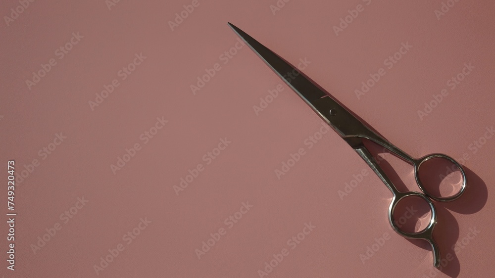 hairdressing scissors on a pink background hairdressing scissors on a pink background