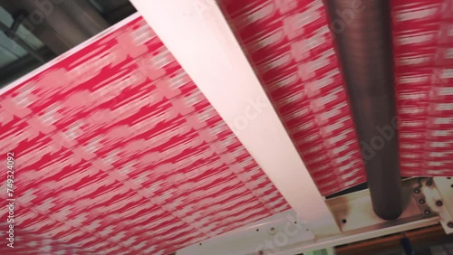 The Inside Scoop on Label Roll Production Process. Labels passing through rollers.