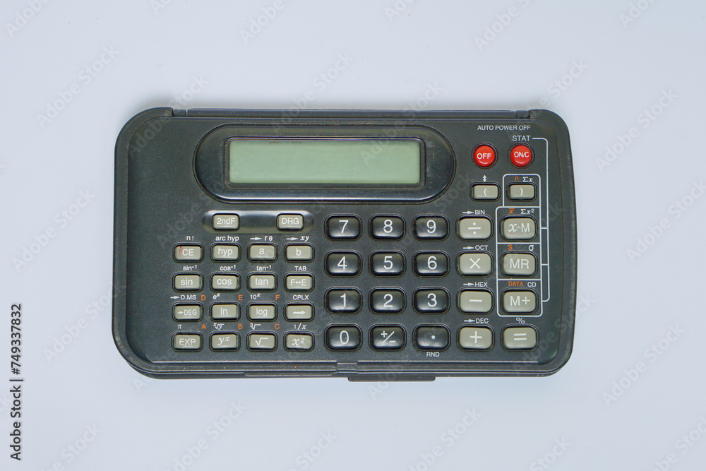 A black plastic scientific calculator on a white background A black plastic scientific calculator on a white background