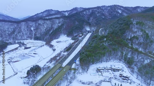 Snowy highway scene on a winter day view show on Drone