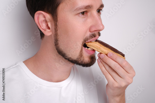 portrait of a man eating cake close-up