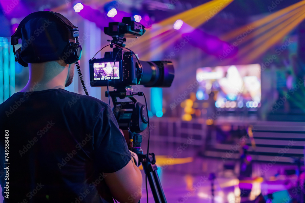 cameraman is filming an entertainment show on the set cameraman is filming an entertainment show on the set