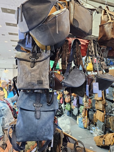 roadside hawker stall with different size purse and bags hanging