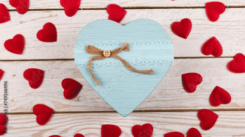Ideal gift setup for her: top view chic presents, love hearts on a wooden backdrop, leaving space for your message or ads