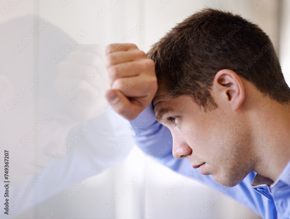 Stress, thinking and businessman at window upset for bankruptcy, debt and sad unemployment. Anxiety, depression and frustrated man in office with job loss, mental health and depression at business Stress, thinking and businessman at window upset for bankruptcy, debt and sad unemployment. Anxiety, depression and frustrated man in office with job loss, mental health and depression at business