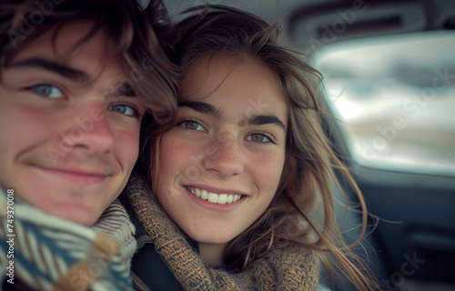 Pretty lovely couple sitting inside a retro car