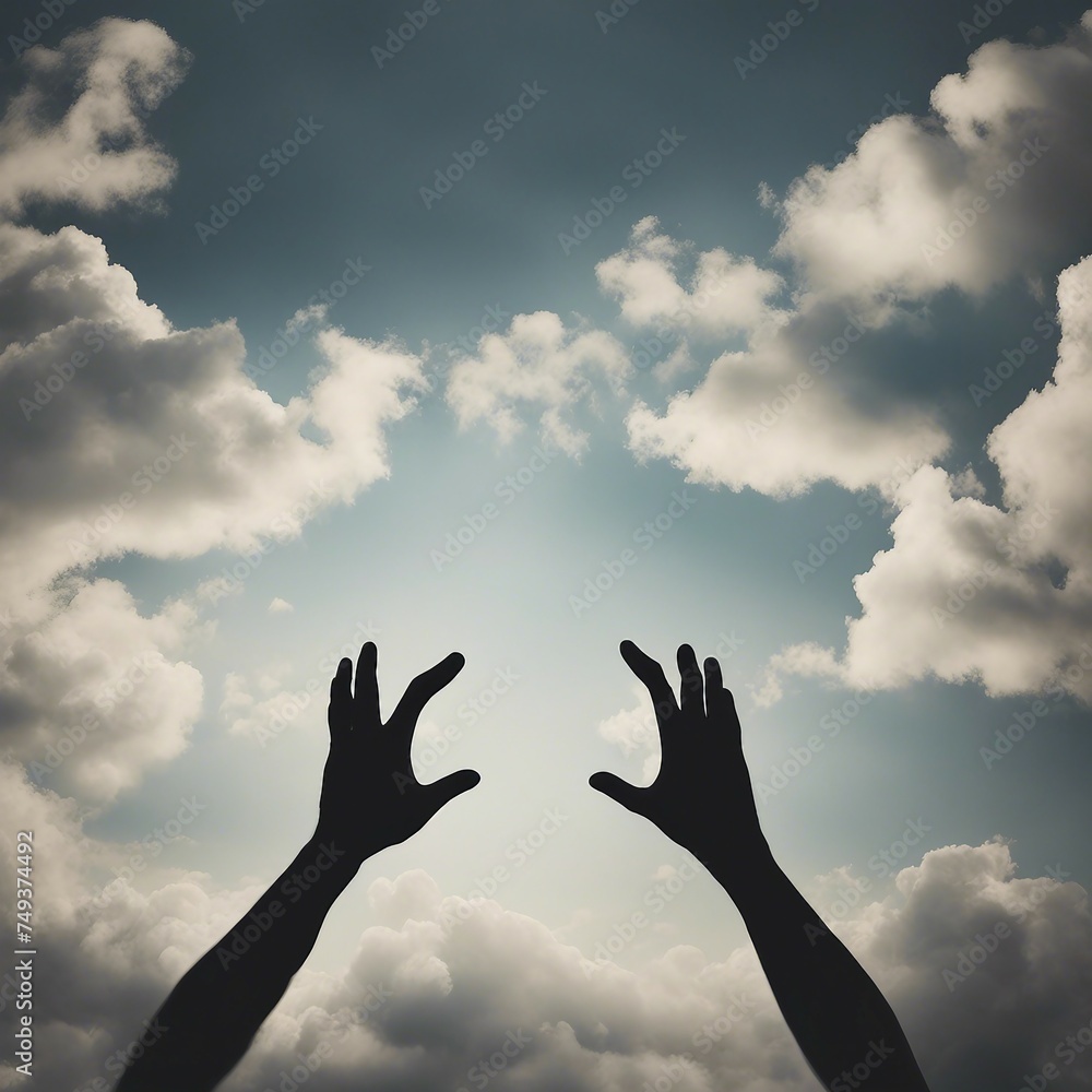 Two hands silhouettes reaching to the sky reaching the clouds Two hands silhouettes reaching to the sky reaching the clouds