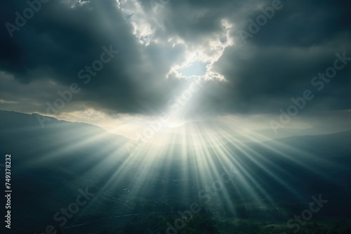 Crepuscular rays piercing through a monsoon cloud bank