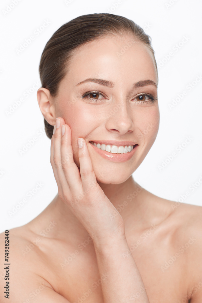 Woman, touching face and skincare, beauty and natural cosmetics with dermatology on white background. Hands, skin and self care, clean facial and wellness, model in portrait with glow in studio Woman, touching face and skincare, beauty and natural cosmetics with dermatology on white background. Hands, skin and self care, clean facial and wellness, model in portrait with glow in studio