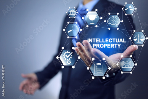 Intellectual property concept with businessman hold the right properties follow law of inventor for new innovation