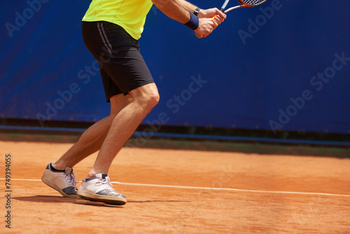 Person, legs and competition on tennis court, athlete and serve racket or ball for professional match. Fitness, outdoor or player in sport training for tournament or skill of strong champion in game