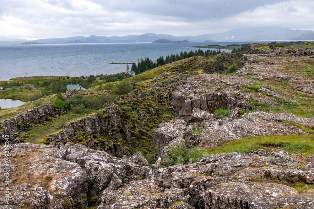 Panoramic view over the seismic rift valley between the Eurasian and North American tectonic plates in Pingvellir National Park, Iceland with Pingvallavatn lake in background