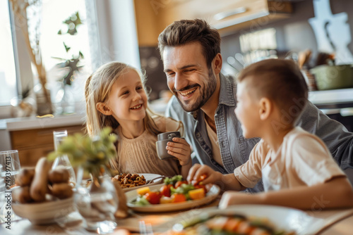 Young happy family having fun while having lunch at home