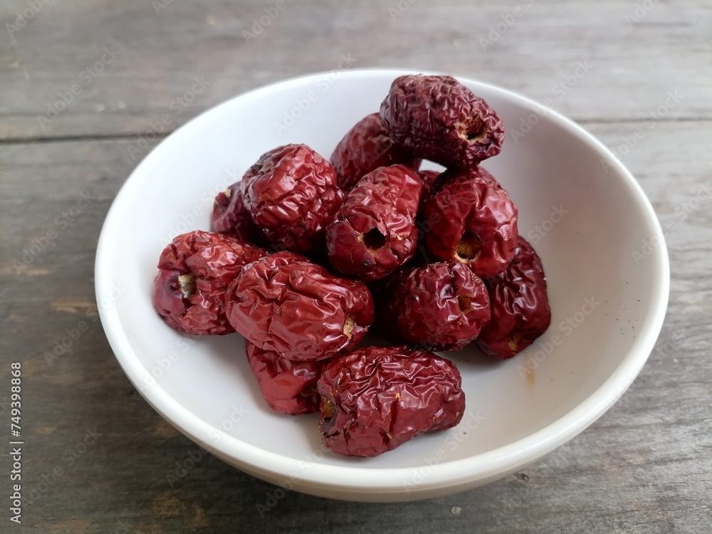 Dried jujube fruit on wood background Dried jujube fruit on wood background