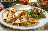 Three quesadillas and salad perfect for sharing, mexican food stock photo