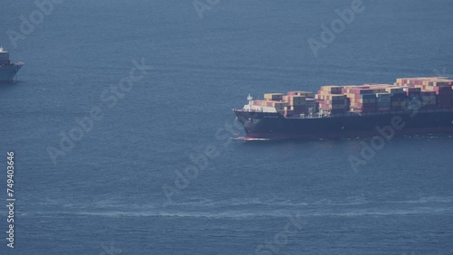 Close up of container ship in the Bay of Gibraltar after leaving the Algeciras port