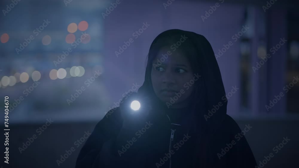 Hooded Fearless Woman Walking in Abandoned Urban Town at Twilight Light Hooded Fearless Woman Walking in Abandoned Urban Town at Twilight Light