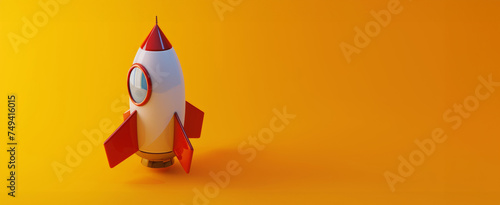A playful, bright toy rocket on an orange background symbolizing adventure and innovation, ideal for children's events or science-themed celebrations. photo
