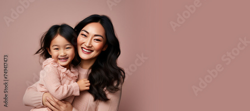 Mother's Day Happy Mother and Daughter on a Pink Banner with Space for Copy