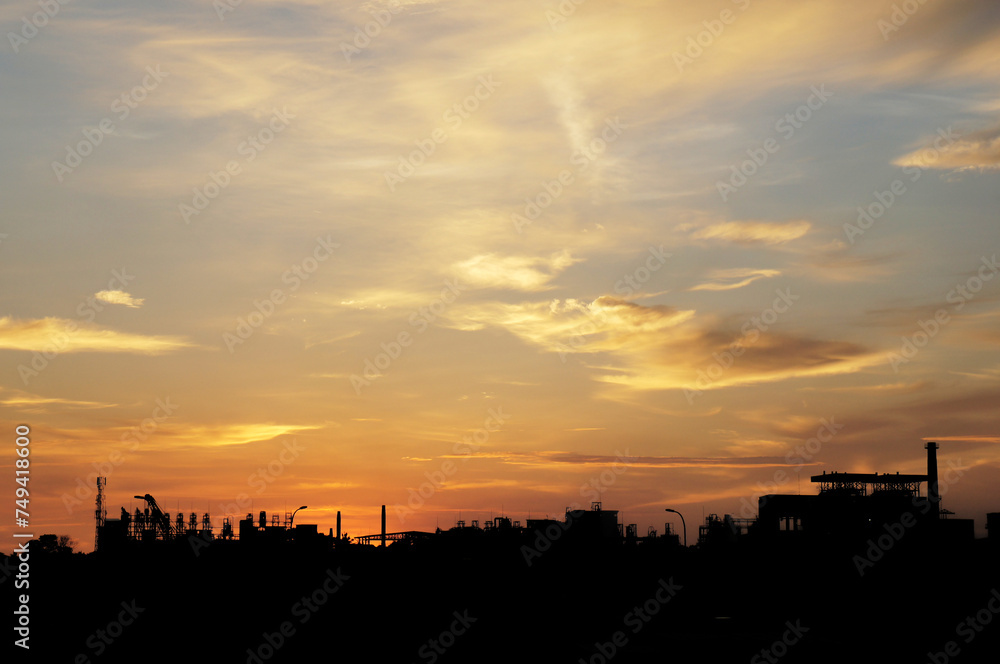silhouette of a factory at sunset