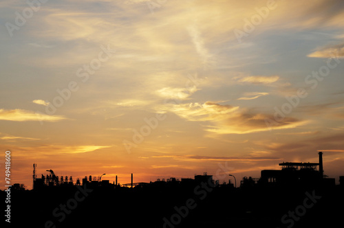 silhouette of a factory at sunset © fregia