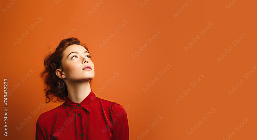 Woman Looking Up into Copy Space and Thinking