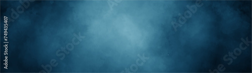 Abstract background with blue paper texture and blue watercolor painting background. smoke fog or clouds in center with dark border grunge design. black and blue grunge watercolor background.