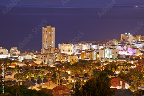 Night  city and buildings with travel and view  architecture and skyscraper with outdoor landscape. Property  real estate and urban development  destination or location with skyline and background