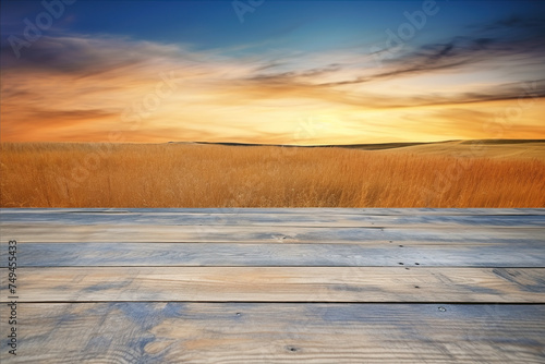 Empty wooden deck table with wheat field and sunset sky background. Ready for product display montage photo