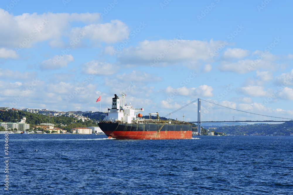 Ship passing the Bosphorus Bridge at Besiktas, Istanbul, Turkey