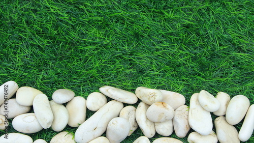 Natural stone with texture, green grass, background
