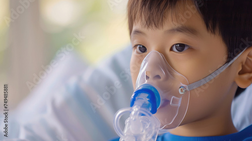 Asian Boy in Pediatric Care Using Nebulizer Mask for Respiratory Therapy
