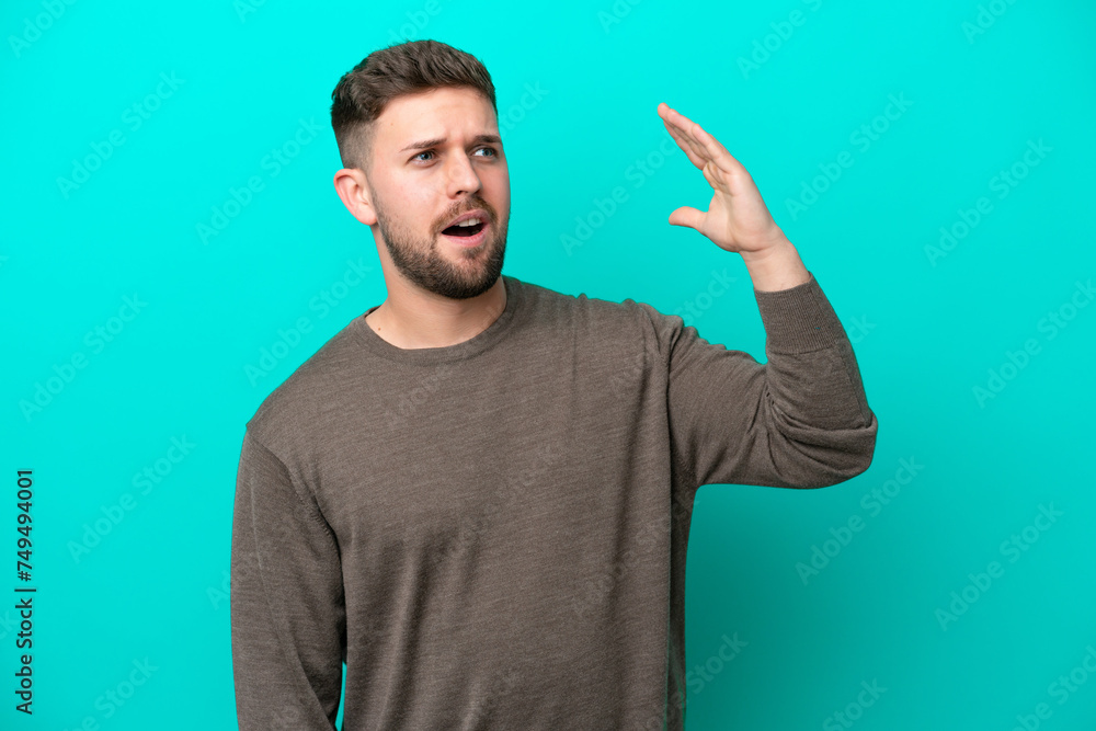 Young caucasian man isolated on blue background with tired and sick expression Young caucasian man isolated on blue background with tired and sick expression
