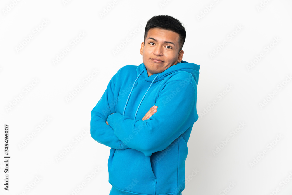 Young Ecuadorian man isolated on white background making doubts gesture while lifting the shoulders Young Ecuadorian man isolated on white background making doubts gesture while lifting the shoulders