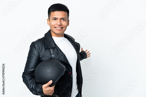 Ecudorian man with a motorcycle helmet isolated on white background extending hands to the side for inviting to come