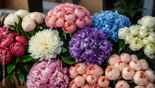 Multicolored pions in a flower shop - fresh supply of cut flowers for spring holidays, floral shop.  photo
