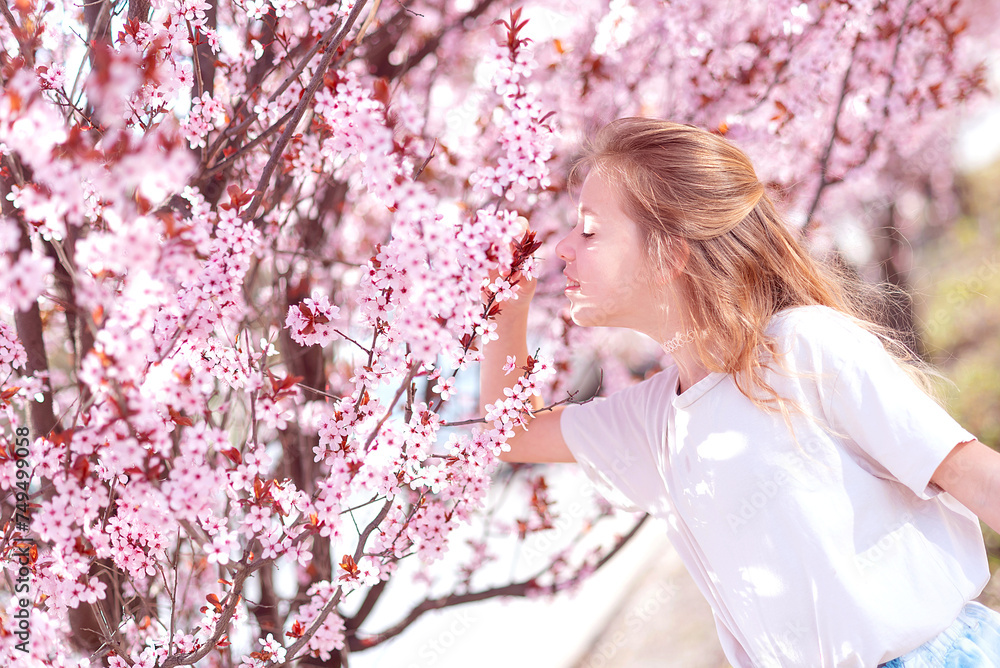 girl in a blooming sakura garden. Spring girl in a blooming sakura garden. Spring