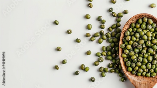 mung beans on a wooden spoon on a white background photo