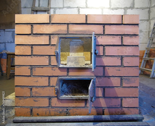 construction of brick ovens. brick stove for sauna. heating stone stove.