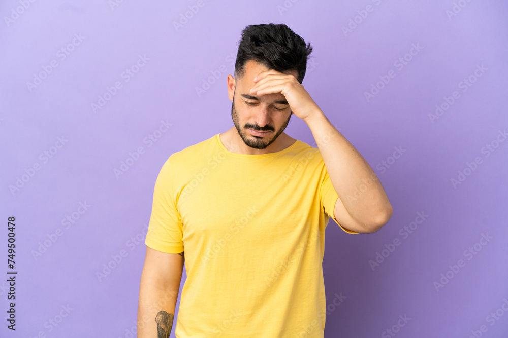 Young caucasian man isolated on purple background with headache Young caucasian man isolated on purple background with headache